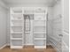 Walk-in closet with custom shelving and organization system at 110 Lantern Acres Dr, Mooresville, NC 28115