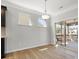 Dining area with wood flooring, sliding glass doors to deck, recessed lighting, and nearby kitchen at 110 Lantern Acres Dr, Mooresville, NC 28115