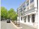 Street view of stylish condo/apartment buildings showcasing modern architecture, curb appeal, and street-side charm at 110 Lantern Acres Dr, Mooresville, NC 28115