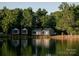 A lakeside retreat featuring modern cabins, perfect for serene waterfront living at 110 Lantern Acres Dr, Mooresville, NC 28115