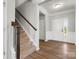 Welcoming foyer with hardwood floors and staircase, offering a view of the front door at 110 Lantern Acres Dr, Mooresville, NC 28115