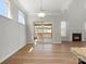 Bright living room with sliding doors leading to a patio with a fireplace creating a cozy atmosphere at 110 Lantern Acres Dr, Mooresville, NC 28115