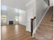 Spacious living room with hardwood floors, fireplace, and plenty of natural light at 110 Lantern Acres Dr, Mooresville, NC 28115