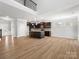 Open floorplan with modern kitchen island and dark cabinetry for seamless living and entertaining at 110 Lantern Acres Dr, Mooresville, NC 28115
