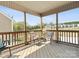 Screened porch with two chairs and a small table that offers views of the neighborhood at 110 Lantern Acres Dr, Mooresville, NC 28115