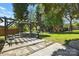 Backyard view of a patio with pergola and furniture and a small outbuilding in the distance at 110 Tanglewood Dr, Kannapolis, NC 28081