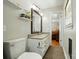 Charming bathroom featuring granite countertop and wood-look flooring at 110 Tanglewood Dr, Kannapolis, NC 28081