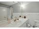 White bathroom with traditional tiles and decor at 110 Tanglewood Dr, Kannapolis, NC 28081