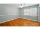 Bright bedroom featuring hardwood flooring, ceiling fan, and neutral walls at 110 Tanglewood Dr, Kannapolis, NC 28081