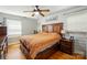 Comfortable bedroom with hardwood floors, a ceiling fan, and natural light from the windows at 110 Tanglewood Dr, Kannapolis, NC 28081