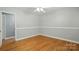 Bright bedroom featuring hardwood flooring, ceiling fan and neutral walls at 110 Tanglewood Dr, Kannapolis, NC 28081