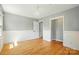 Bright bedroom with hardwood flooring and neutral wall paint at 110 Tanglewood Dr, Kannapolis, NC 28081
