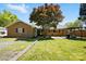 Lovely brick home with a well-manicured lawn, a pergola, and inviting outdoor spaces at 110 Tanglewood Dr, Kannapolis, NC 28081