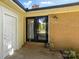 Charming brick home featuring a black double-door front entrance and a practical white side door at 110 Tanglewood Dr, Kannapolis, NC 28081