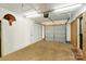 Functional garage space with overhead lighting and convenient access to the home at 110 Tanglewood Dr, Kannapolis, NC 28081
