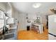 Open kitchen design featuring an island with bar seating and white cabinetry at 110 Tanglewood Dr, Kannapolis, NC 28081