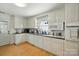 Bright kitchen with white cabinets, sleek countertops, and a functional layout at 110 Tanglewood Dr, Kannapolis, NC 28081