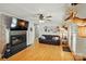Cozy living room with a fireplace, hardwood floors, and comfortable seating at 110 Tanglewood Dr, Kannapolis, NC 28081