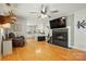 Spacious living room featuring a fireplace, hardwood floors, and an open layout at 110 Tanglewood Dr, Kannapolis, NC 28081