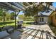Outdoor patio space with pergola, seating, and a grill, ideal for entertaining and relaxation at 110 Tanglewood Dr, Kannapolis, NC 28081