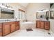 Elegant bathroom features a soaking tub, double vanities, and granite countertops at 112 Spring Branch Rd, Fort Mill, SC 29715