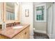 Elegant bathroom with granite countertop, decorative mirror, and neutral decor at 112 Spring Branch Rd, Fort Mill, SC 29715