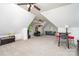 Spacious bonus room featuring plush carpeting, natural light, and two seating areas at 112 Spring Branch Rd, Fort Mill, SC 29715