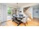 Elegant dining room with a large window, modern light fixture, and seating for six, perfect for gatherings at 112 Spring Branch Rd, Fort Mill, SC 29715