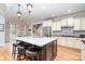 Bright, airy kitchen with a large island, modern appliances, and stylish lighting, perfect for cooking and entertaining at 112 Spring Branch Rd, Fort Mill, SC 29715