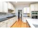 Modern kitchen featuring stainless steel appliances, granite countertops, and stylish backsplash, perfect for cooking at 112 Spring Branch Rd, Fort Mill, SC 29715