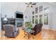 Comfortable living room with stone fireplace, vaulted ceilings, and hardwood floors at 112 Spring Branch Rd, Fort Mill, SC 29715