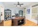 Well-lit home office featuring a large desk, built-in shelving, and natural light, ideal for remote work and study at 112 Spring Branch Rd, Fort Mill, SC 29715