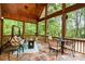 Stunning open porch provides a serene outdoor living space with beautiful wooded views at 112 Spring Branch Rd, Fort Mill, SC 29715