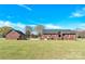 Exterior of brick house and garage with yard at 115 Green Sw St, Concord, NC 28027