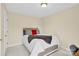 Well-lit bedroom with carpeted floors and a comfortable bed at 115 Green Sw St, Concord, NC 28027