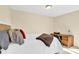 Cozy bedroom with a bed, desk, and warm lighting at 115 Green Sw St, Concord, NC 28027
