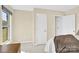 Bright bedroom with a window and doorway to an ensuite at 115 Green Sw St, Concord, NC 28027