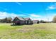 Expansive yard surrounds this brick home with a detached garage, perfect for outdoor enjoyment at 115 Green Sw St, Concord, NC 28027