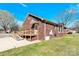 Brick house with wooden wheelchair ramp to the side entry at 115 Green Sw St, Concord, NC 28027