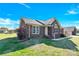 Charming brick home featuring a well-manicured lawn and traditional architectural details at 115 Green Sw St, Concord, NC 28027