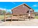 Brick home with wooden wheelchair ramp to the side entry at 115 Green Sw St, Concord, NC 28027