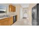 Kitchen with wooden cabinets, stainless steel sink, and a black dishwasher at 115 Green Sw St, Concord, NC 28027