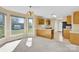 Bright kitchen and dining area features large windows and a kitchen island at 115 Green Sw St, Concord, NC 28027