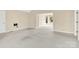 Open-concept living area with neutral walls and carpeting, offering a versatile space for relaxation at 115 Green Sw St, Concord, NC 28027