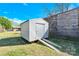 Metal shed with door and ramp on grass lawn at 115 Green Sw St, Concord, NC 28027