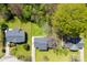 An aerial view showcases the home nestled amongst lush greenery and adjacent homes at 116 Ridgewood Dr, York, SC 29745