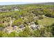 An aerial view showcases a neighborhood with surrounding lush green landscapes at 116 Ridgewood Dr, York, SC 29745