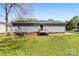 Well-maintained backyard featuring a fenced yard, green grass, and access to the house from the wooden deck at 116 Ridgewood Dr, York, SC 29745