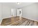 Bedroom featuring wood-look flooring with access to a bathroom and the kitchen at 116 Ridgewood Dr, York, SC 29745