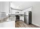 A bright kitchen showcasing granite countertops, stainless steel appliances, and white cabinets at 116 Ridgewood Dr, York, SC 29745